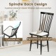 Black Windsor dining chair with ergonomic curved backrest and removable cushion, perfect for dining rooms and kitchens.