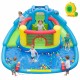 Dinosaur-themed inflatable water slide park with double slides, splash pool, and water cannons for backyard fun.