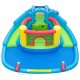 Dinosaur-themed inflatable bounce house with double slides, splash pool, and climbing wall for backyard fun.