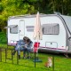 Dog playpen with 16 panels, 24 inches high, featuring a secure lock and large door for indoor and outdoor use.