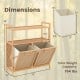 Double tilt-out laundry hamper with natural bamboo frame, featuring two removable baskets and two open shelves for storage.