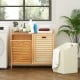 Double tilt-out laundry hamper in natural bamboo with two removable bins and top shelf, perfect for laundry room.