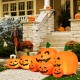 Colorful inflatable Halloween pumpkin patch with LED lights, featuring seven cheerful pumpkins for festive outdoor.