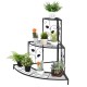 Three-tier floral corner metal plant pot rack in black, ideal for displaying potted plants and decorative items.