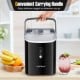 Nugget countertop ice maker in black with a carrying handle, producing soft chewable ice for beverages.