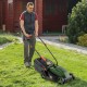 Electric corded lawn mower in black and green with a 13-inch cutting width and foldable handle for easy storage.