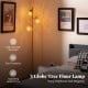Golden 3-globe floor lamp showcasing elegant acrylic shades and a sturdy, high-strength metal structure for stylish.