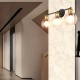 Modern 3-light bubbled glass vanity light with black iron frame and golden sockets, ideal for bathroom or hallway decor.