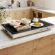 Electric warming tray with adjustable temperature, tempered glass top, and built-in handles for easy serving and.