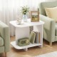 White 2-tier end table with rounded corners, featuring a storage shelf, perfect for living room or bedroom use.