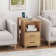 End table with built-in charging station, two drawers, and wheels for easy mobility, perfect for bedside or sofa use.