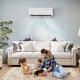 Mini split heat pump mounted on the wall, providing efficient heating and cooling in a cozy living room setting.