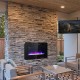 36-inch wall-mounted electric fireplace in black, featuring 12 flame colors and remote control for cozy home ambiance.