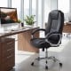 Ergonomic black leather office chair with padded armrests and rocking backrest, designed for comfort and support.