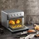 Air fryer toaster oven with 21.5 QT capacity, stainless steel design, and multiple cooking modes for family meals.