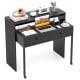 Extendable black computer desk with two storage drawers, monitor shelf, and lockable wheels for home office use.