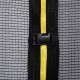 Close-up of the trampoline net enclosure with yellow zipper and buckle, designed for safety and stability.