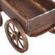 Wood wagon planter pot stand with wheels, made of solid fir wood, featuring a rustic design for outdoor decoration.
