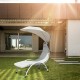 Chaise lounge chair with wide beige canopy, ergonomic design, providing ample shade for comfortable outdoor relaxation.