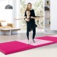 Folding exercise mat in hot pink, featuring four panels and carrying handles, ideal for gymnastics and stretching.