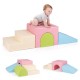 Infant playing on the Climb and Crawl Foam Block Play Set, showcasing the slide and steps in a multicolor design.