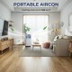 Portable air conditioner in a living room, 10000 BTU, features cooling, dehumidifying, and fan modes for versatile.
