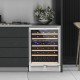 Dual zone wine cooler for 51 bottles with a reversible door, featuring beech wood shelves and blue LED lights for.