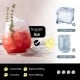 Nugget ice in a glass with herbs, showcasing the self-dispensing countertop ice maker for crunchy, chewable ice.