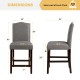 Side view of a gray fabric counter height dining chair with rubberwood legs and nail head detailing, ideal for modern.