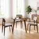 Round walnut dining table for 4 with rubber wood legs, featuring a unique triangle-shaped tabletop for stylish.