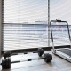 Dumbbell weight set with 3-in-1 folding treadmill in a fitness room, featuring a 3HP motor and LED display.
