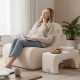 Curved beige floor chair with detachable headrest, designed for comfort and relaxation in living spaces.