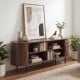 Fluted TV stand in walnut with curved design, featuring 8 compartments and elevated legs for versatile storage and.