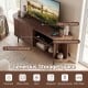 Fluted TV stand in walnut finish with spacious tabletop and 8 compartments for organized storage and elegant design.