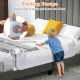 Foldable bed rail in light gray allows kids to safely get in and out of bed with soft padding and adjustable strap.