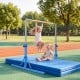 Kids enjoy swinging on the foldable blue gymnastics bar, adjustable from 35.5" to 59" for versatile training.