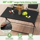 Large black foldable outdoor dining table with slatted metal tabletop, ideal for patio or garden gatherings.