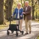Foldable rollator walker with seat for seniors, featuring a carbon fiber structure and adjustable handrails, ideal for.