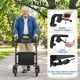 Foldable rollator walker with seat, featuring a secure brake system and adjustable handrails for seniors in a park.