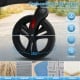 Close-up of the 8-inch low-noise wheels of the black foldable rollator walker, designed for smooth movement on various.