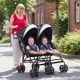 Foldable twin baby double stroller in black with adjustable backrest, lightweight frame, and two children seated.
