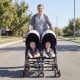 Foldable twin baby double stroller in black with adjustable backrest, lightweight frame, and safety features for easy.