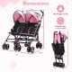 Foldable twin baby double stroller in pink with adjustable backrest, 360-degree swivel wheels, and ventilated canopy.
