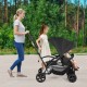 Foldable twin tandem stroller in black with adjustable handlebar, accommodating younger and older kids for outdoor use.