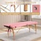 Foldable pink facial spa bed with sturdy beech wood legs, anti-slip footpads, and adjustable height for versatile use.