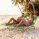 Folding beach lounge chair in lawn-green, adjustable backrest, perfect for relaxing by the ocean or poolside.
