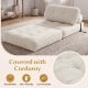 Folding sofa bed in beige with corduroy cover, featuring pillow and back support for versatile living room use.