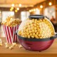 Red 6QT stirring popcorn popper with nonstick plate, making 24 cups of popcorn, perfect for family movie nights.