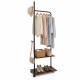 Freestanding clothing rack in rustic brown with wheels, featuring hanging rod and storage shelves for versatile.