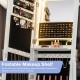 Foldable makeup shelf in a white jewelry armoire, featuring LED lights and storage for cosmetics and accessories.
